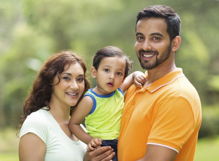 Youth family (mother, father, child) of South Asian appearance